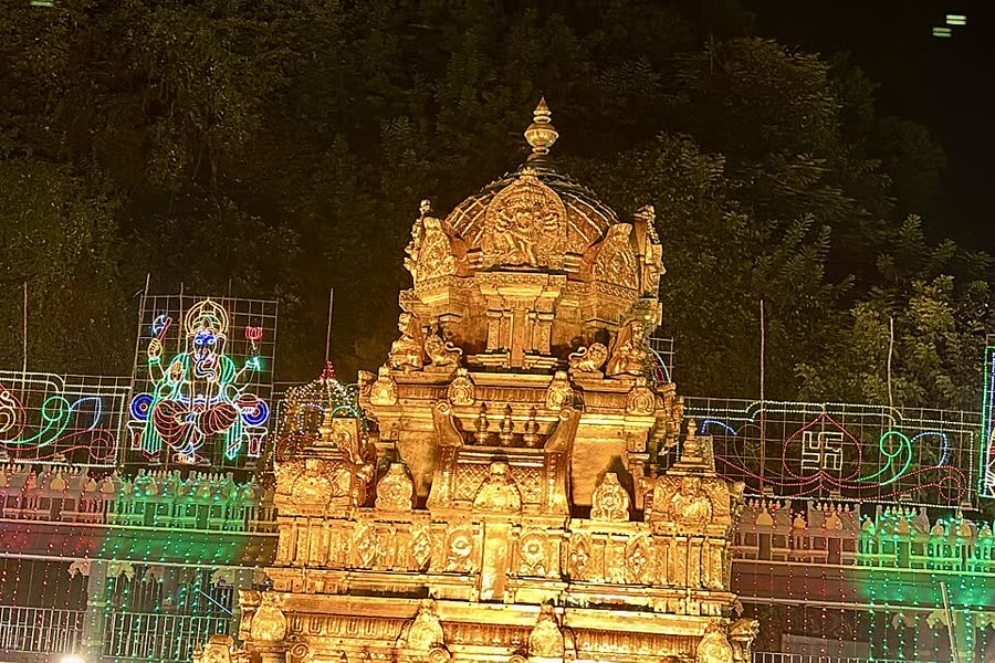 The golden gopuram of the Kanaka Durga temple in Vijayawada lit up at night